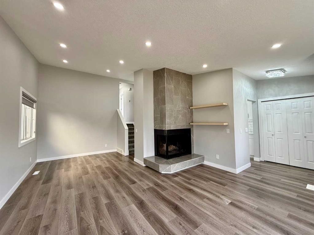 36 Whitehaven Road Ne, Calgary, AB - Indoor With Fireplace