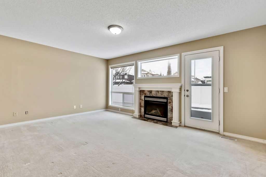 19 Citadel Estates Manor Nw, Calgary, AB - Indoor Photo Showing Living Room With Fireplace