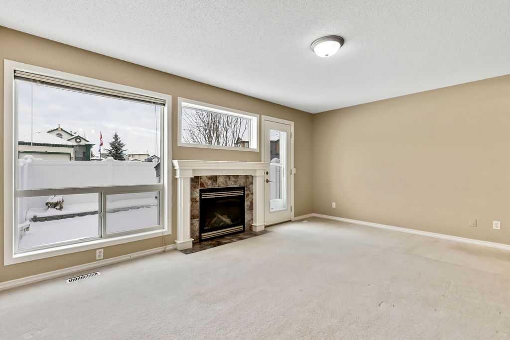 19 Citadel Estates Manor Nw, Calgary, AB - Indoor Photo Showing Living Room With Fireplace