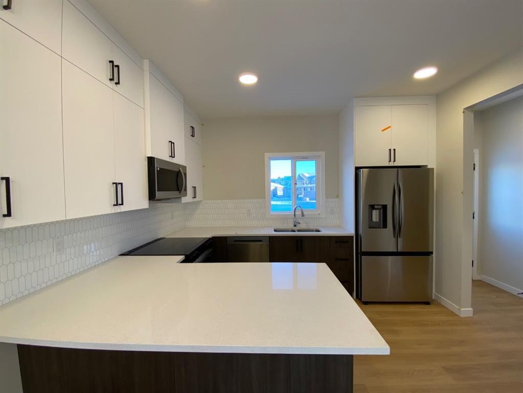341 Ellen Park, Crossfield, AB - Indoor Photo Showing Kitchen With Stainless Steel Kitchen With Double Sink