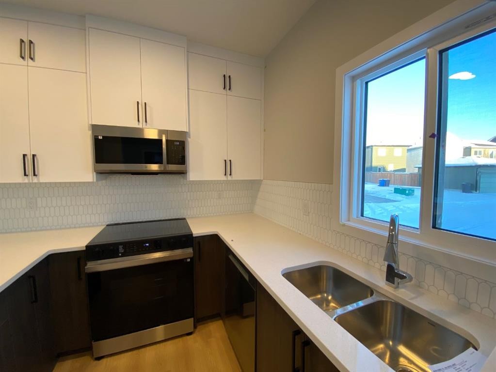 341 Ellen Park, Crossfield, AB - Indoor Photo Showing Kitchen With Double Sink