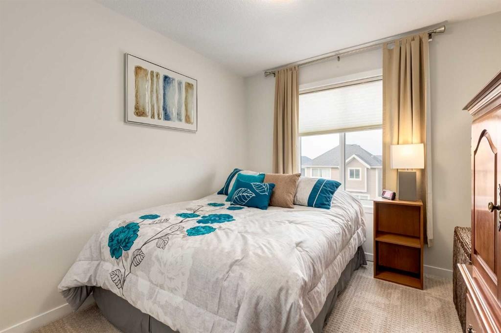 165 Sundown Road, Cochrane, AB - Indoor Photo Showing Bedroom