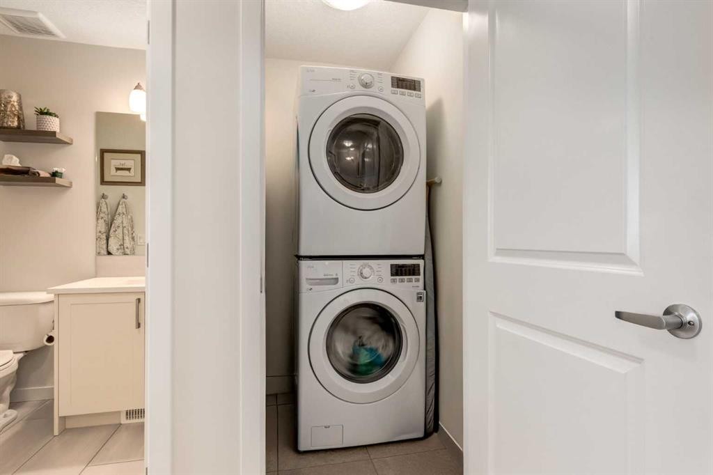 165 Sundown Road, Cochrane, AB - Indoor Photo Showing Laundry Room