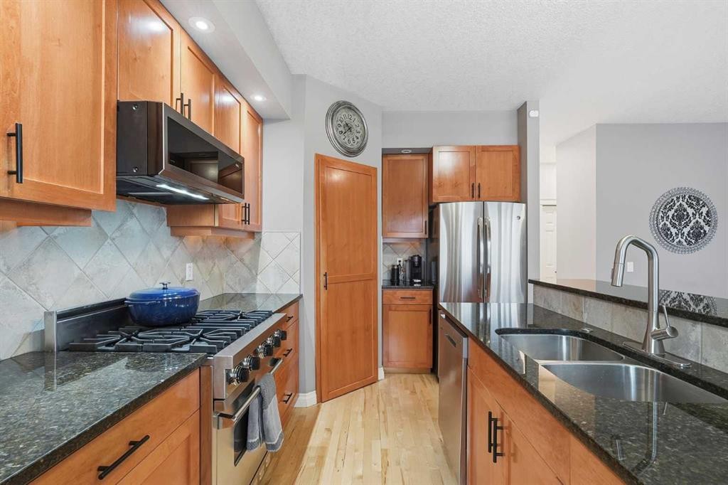 45 Somme Boulevard Sw, Calgary, AB - Indoor Photo Showing Kitchen With Stainless Steel Kitchen With Double Sink