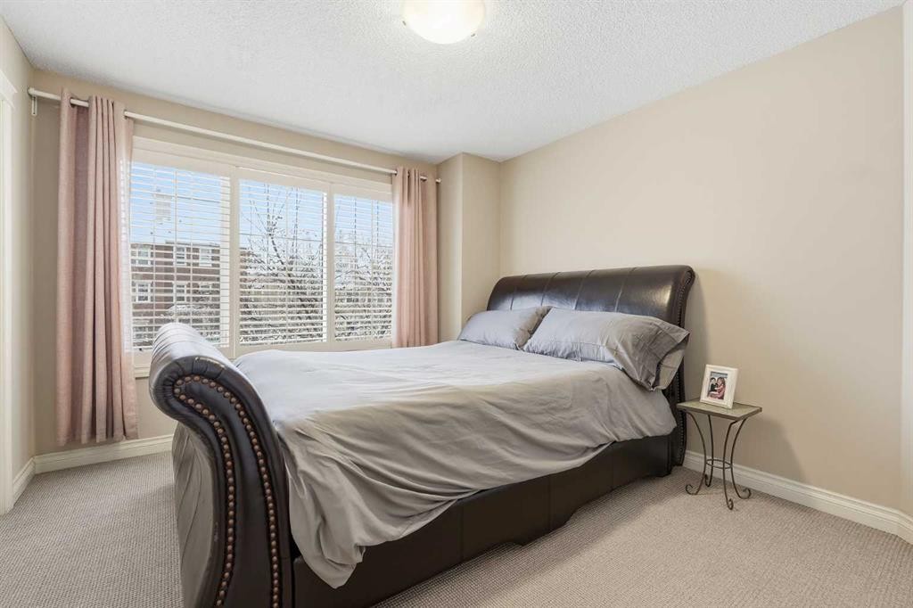 45 Somme Boulevard Sw, Calgary, AB - Indoor Photo Showing Bedroom