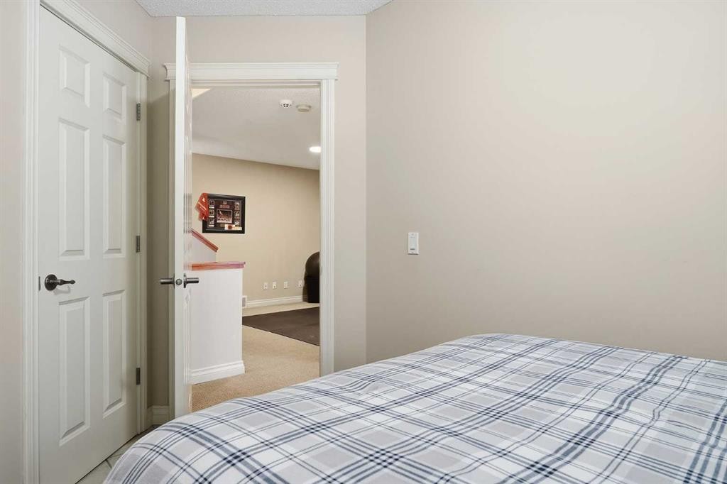 45 Somme Boulevard Sw, Calgary, AB - Indoor Photo Showing Bedroom