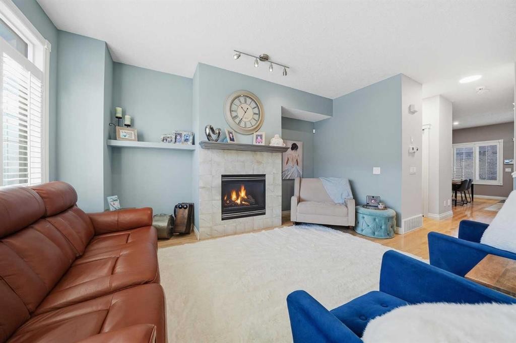 45 Somme Boulevard Sw, Calgary, AB - Indoor Photo Showing Living Room With Fireplace