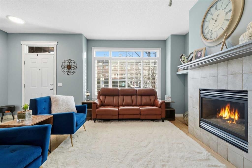 45 Somme Boulevard Sw, Calgary, AB - Indoor Photo Showing Living Room With Fireplace