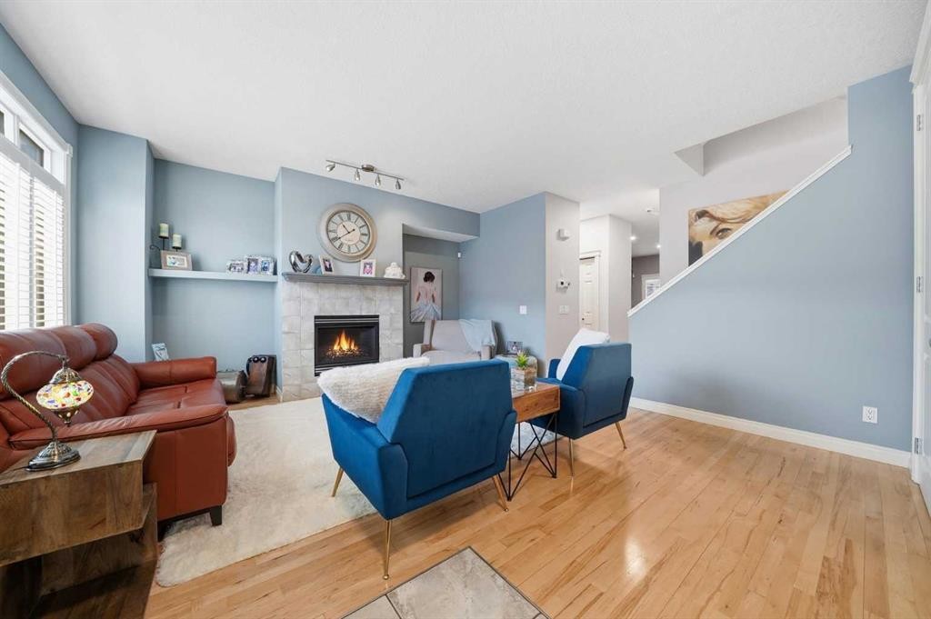 45 Somme Boulevard Sw, Calgary, AB - Indoor Photo Showing Living Room With Fireplace