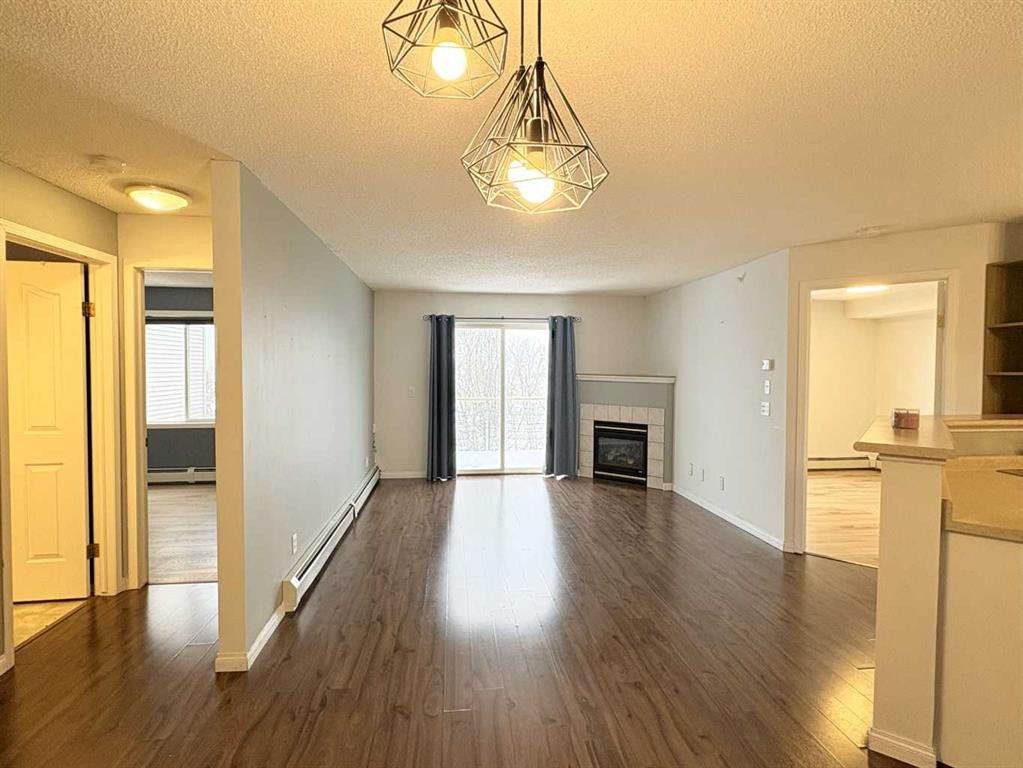 #418-4000 Somervale Court Sw, Calgary, AB - Indoor With Fireplace