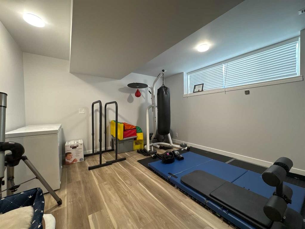 8-304 Ross Avenue, Cochrane, AB - Indoor Photo Showing Gym Room