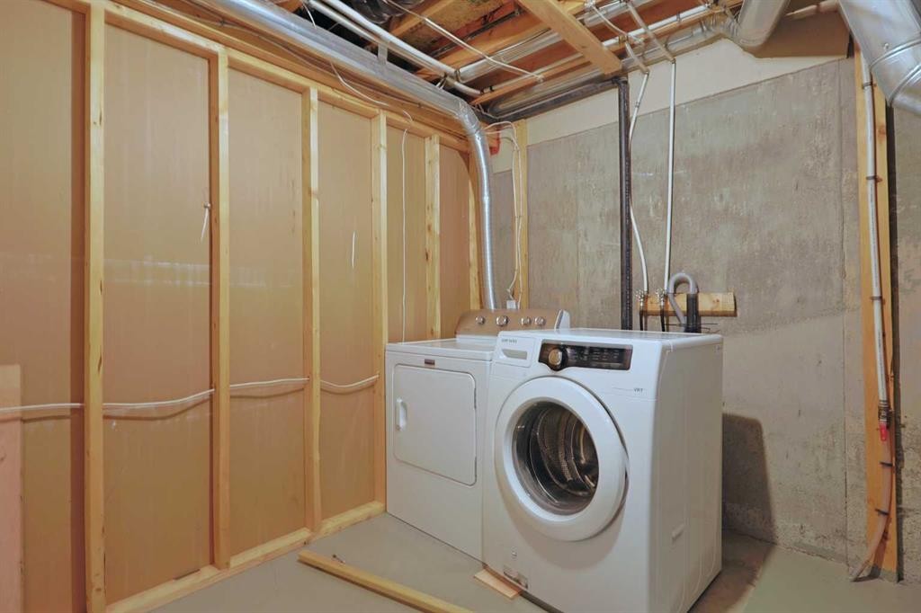 322 Country Village Cape Ne, Calgary, AB - Indoor Photo Showing Laundry Room