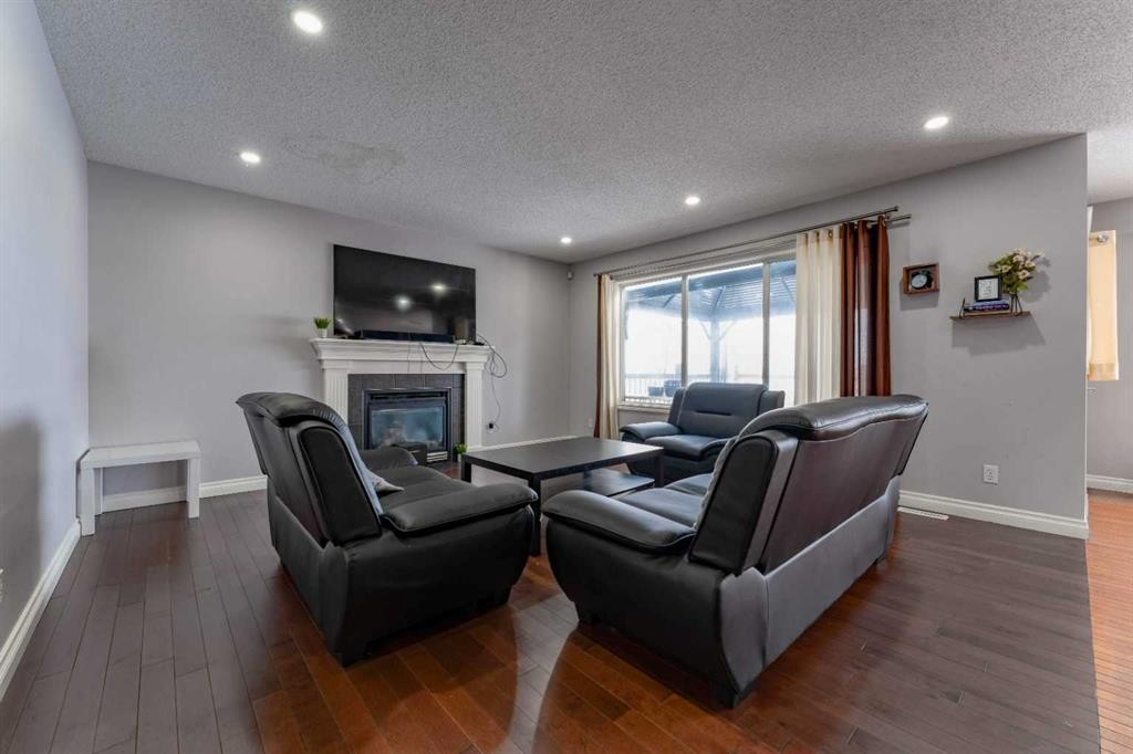236 Willowmere Way, Chestermere, AB - Indoor Photo Showing Living Room With Fireplace