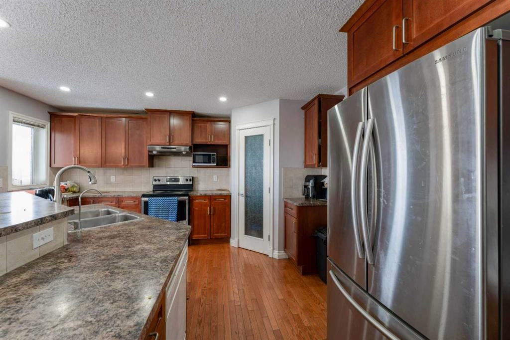 236 Willowmere Way, Chestermere, AB - Indoor Photo Showing Kitchen With Double Sink