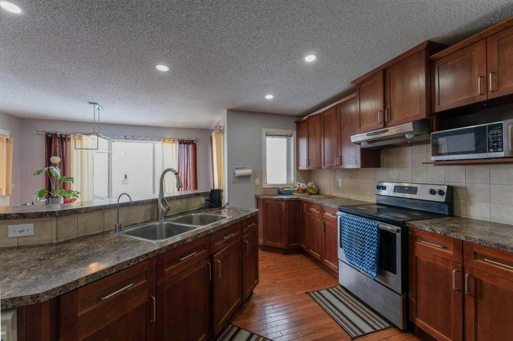 236 Willowmere Way, Chestermere, AB - Indoor Photo Showing Kitchen With Double Sink