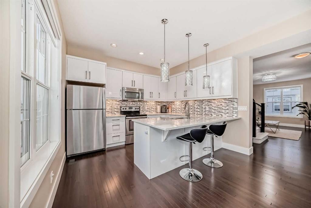 4 Quarry Lane Se, Calgary, AB - Indoor Photo Showing Kitchen With Stainless Steel Kitchen With Upgraded Kitchen