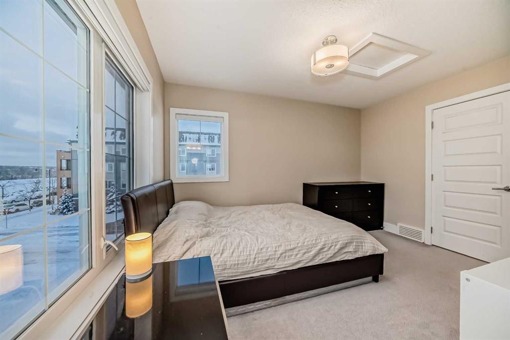4 Quarry Lane Se, Calgary, AB - Indoor Photo Showing Bedroom