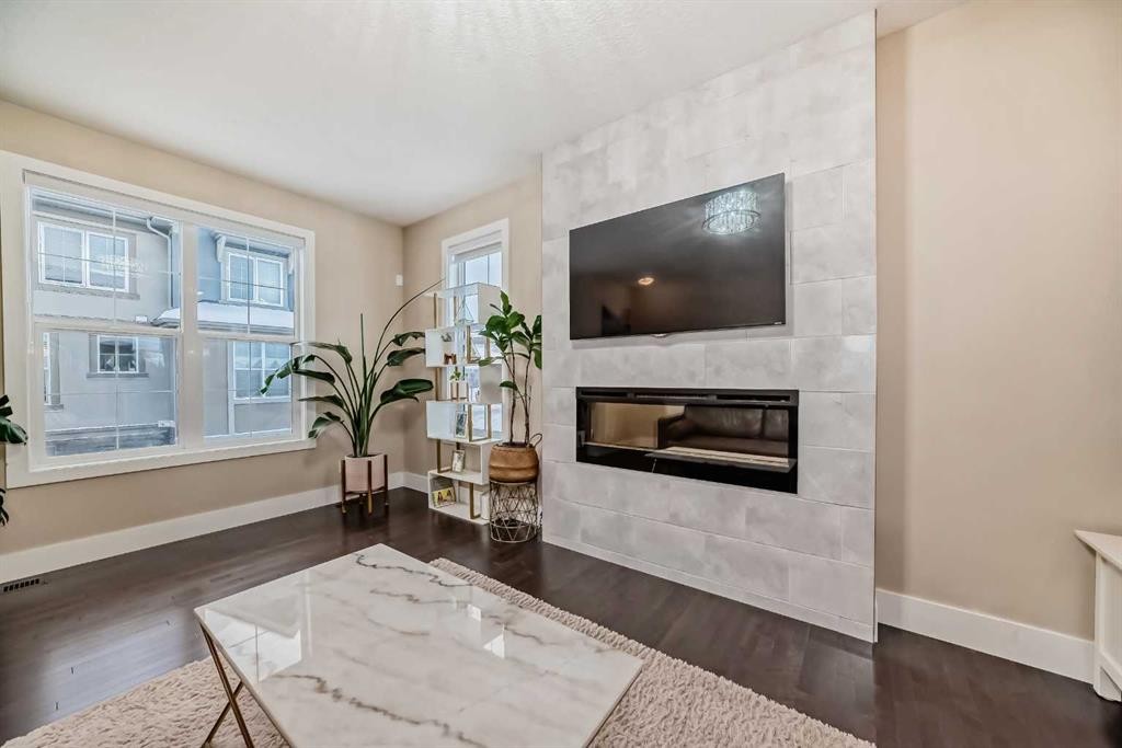 4 Quarry Lane Se, Calgary, AB - Indoor Photo Showing Living Room With Fireplace