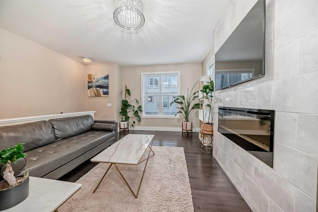 4 Quarry Lane Se, Calgary, AB - Indoor Photo Showing Living Room With Fireplace
