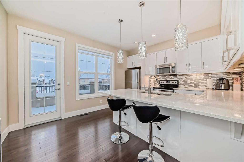 4 Quarry Lane Se, Calgary, AB - Indoor Photo Showing Kitchen With Stainless Steel Kitchen With Upgraded Kitchen