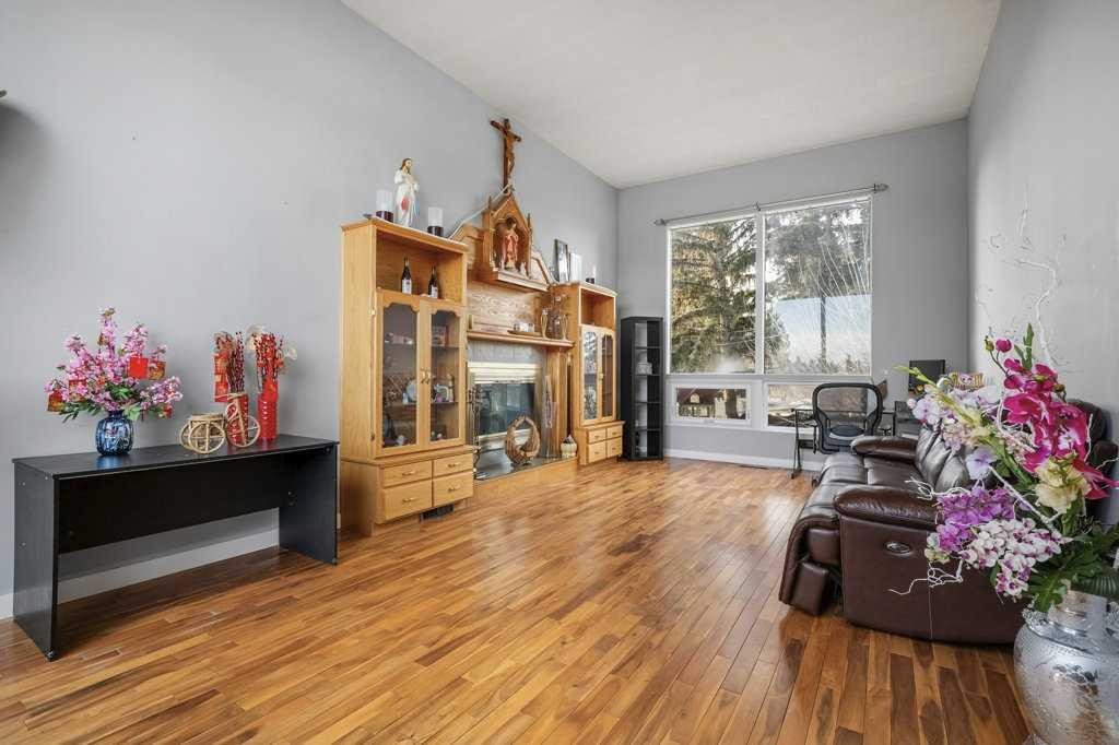 4704 Marbury Place Ne, Calgary, AB - Indoor Photo Showing Living Room With Fireplace