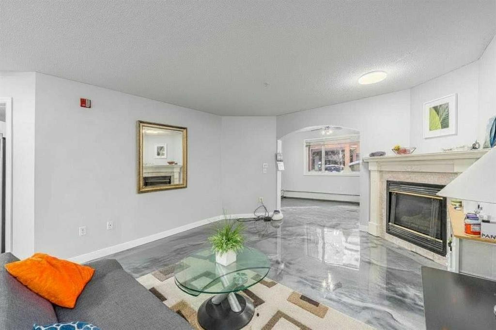 109-777 3 Avenue Sw, Calgary, AB - Indoor With Fireplace