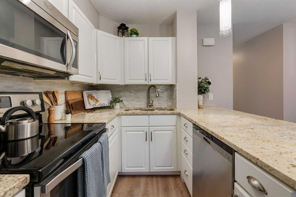 308-13104 Elbow Drive Sw, Calgary, AB - Indoor Photo Showing Kitchen With Upgraded Kitchen