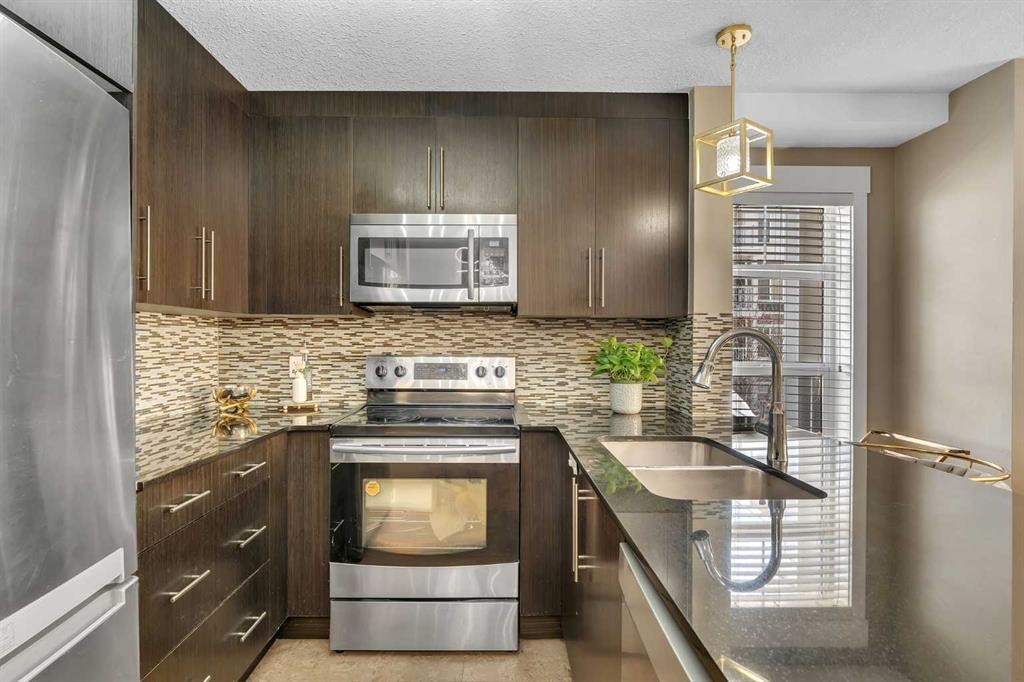 4209-155 Skyview Ranch Way Ne, Calgary, AB - Indoor Photo Showing Kitchen With Stainless Steel Kitchen With Double Sink With Upgraded Kitchen