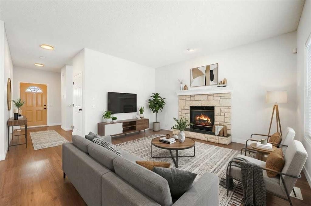 283 Prestwick Landing Se, Calgary, AB - Indoor Photo Showing Living Room With Fireplace