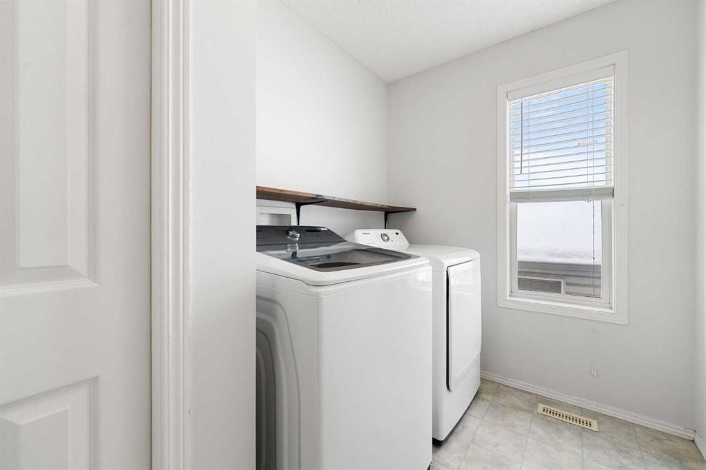 283 Prestwick Landing Se, Calgary, AB - Indoor Photo Showing Laundry Room