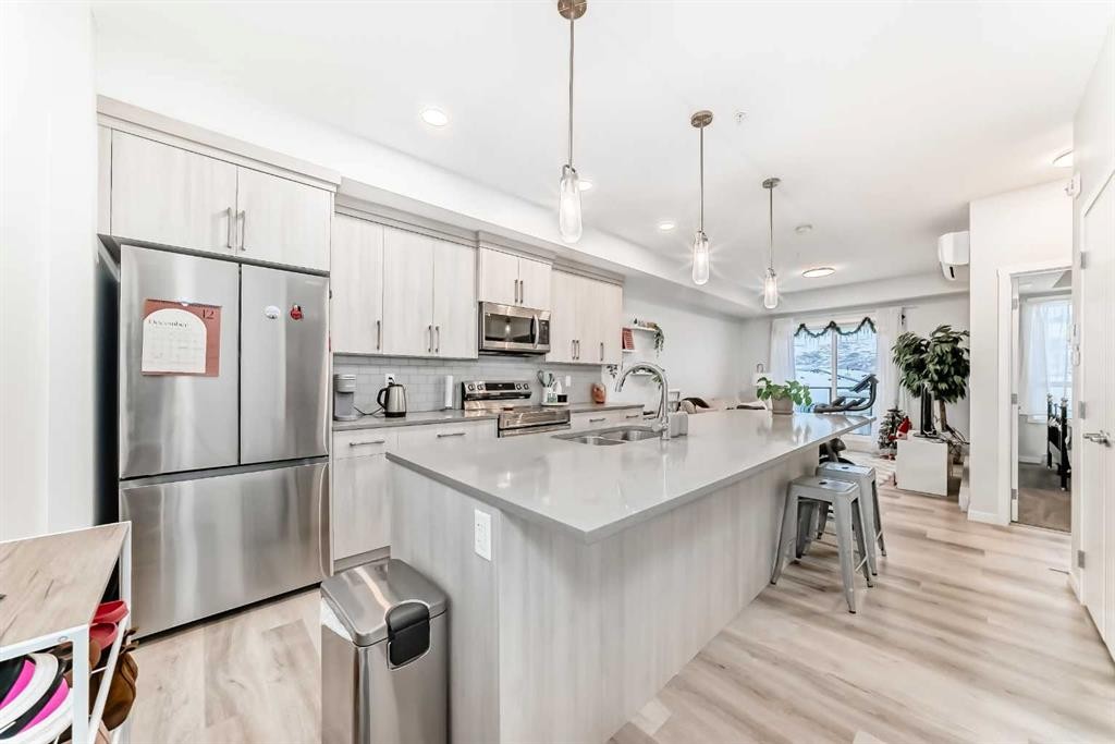 2401-42 Cranbrook Gardens Se, Calgary, AB - Indoor Photo Showing Kitchen With Double Sink With Upgraded Kitchen