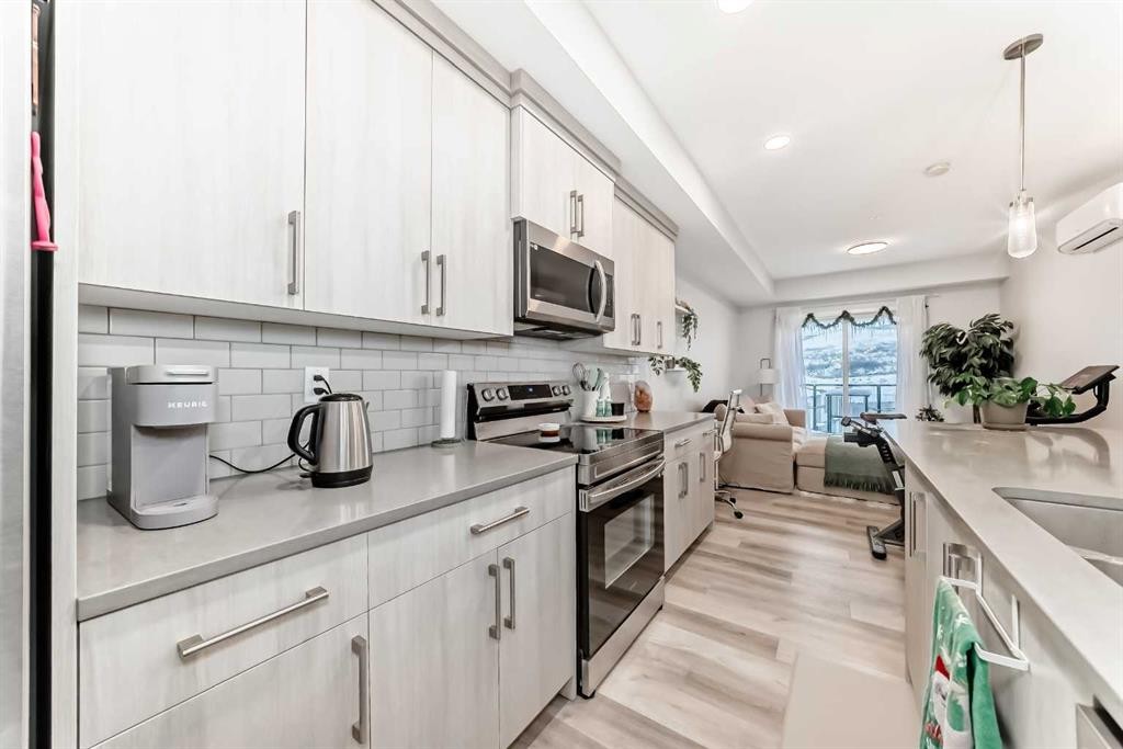 2401-42 Cranbrook Gardens Se, Calgary, AB - Indoor Photo Showing Kitchen With Double Sink With Upgraded Kitchen