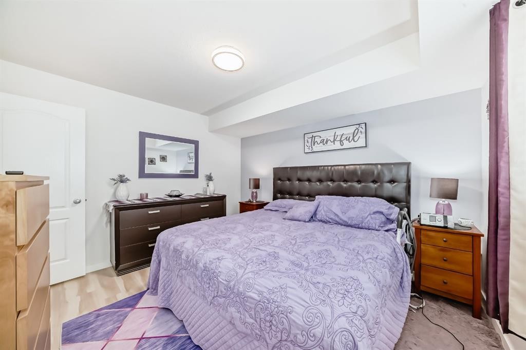 200-8 Bayside Place, Strathmore, AB - Indoor Photo Showing Bedroom