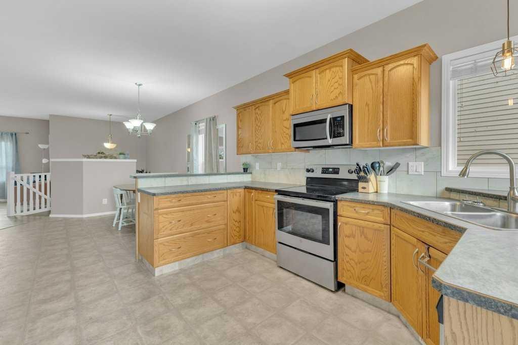 8 Horne Close, Sylvan Lake, AB - Indoor Photo Showing Kitchen With Double Sink