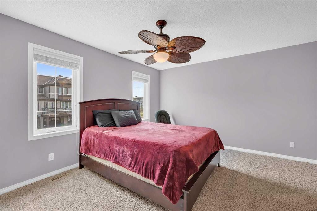 126 Windstone Avenue Sw, Airdrie, AB - Indoor Photo Showing Bedroom