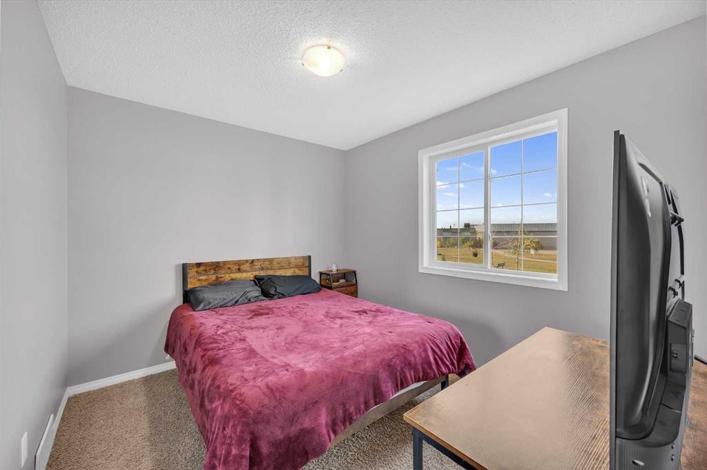 126 Windstone Avenue Sw, Airdrie, AB - Indoor Photo Showing Bedroom