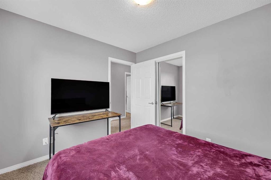 126 Windstone Avenue Sw, Airdrie, AB - Indoor Photo Showing Bedroom
