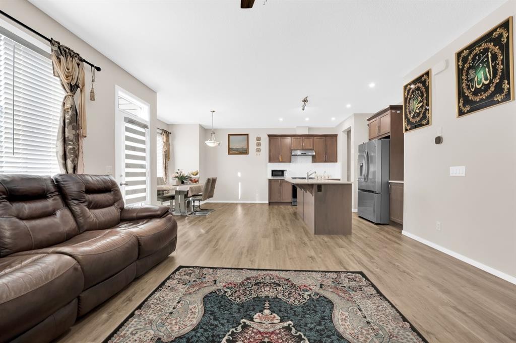 113 Cityline Square Ne, Calgary, AB - Indoor Photo Showing Kitchen With Fireplace