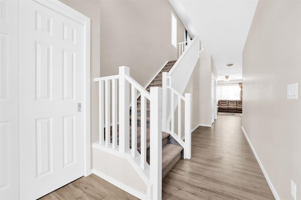 113 Cityline Square Ne, Calgary, AB - Indoor Photo Showing Living Room With Fireplace
