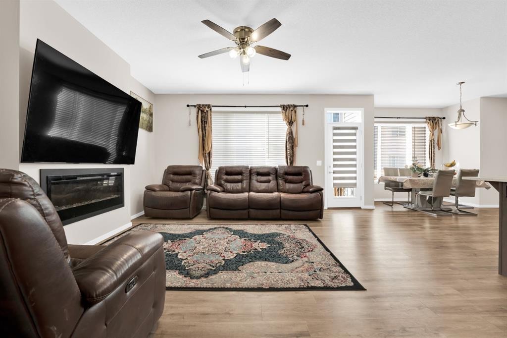 113 Cityline Square Ne, Calgary, AB - Indoor Photo Showing Living Room With Fireplace