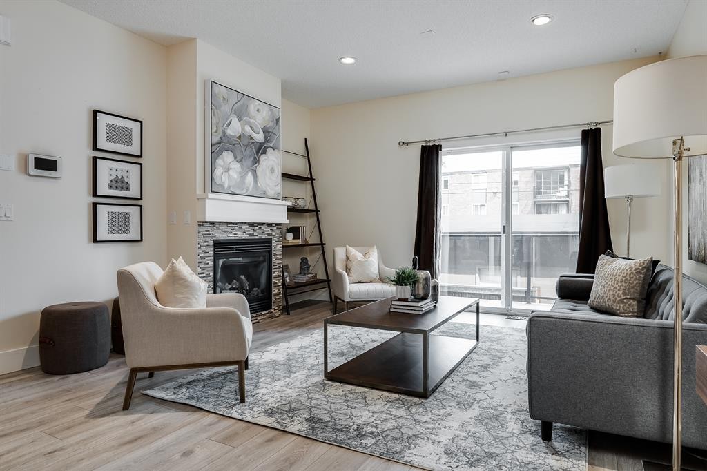 2-2008 12 Avenue Sw, Calgary, AB - Indoor Photo Showing Living Room With Fireplace