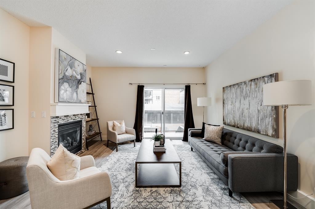 2-2008 12 Avenue Sw, Calgary, AB - Indoor Photo Showing Living Room With Fireplace