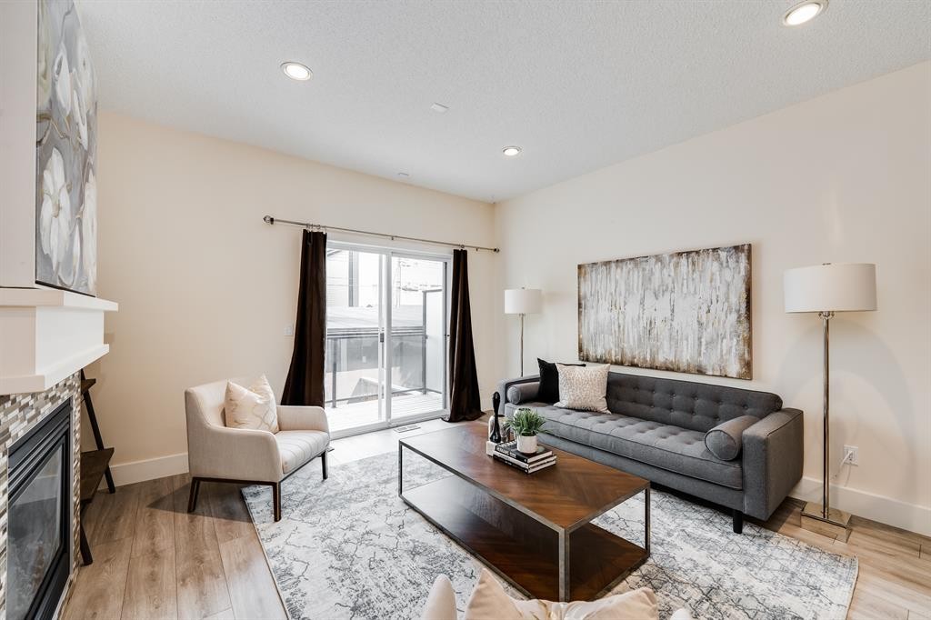 2-2008 12 Avenue Sw, Calgary, AB - Indoor Photo Showing Living Room With Fireplace