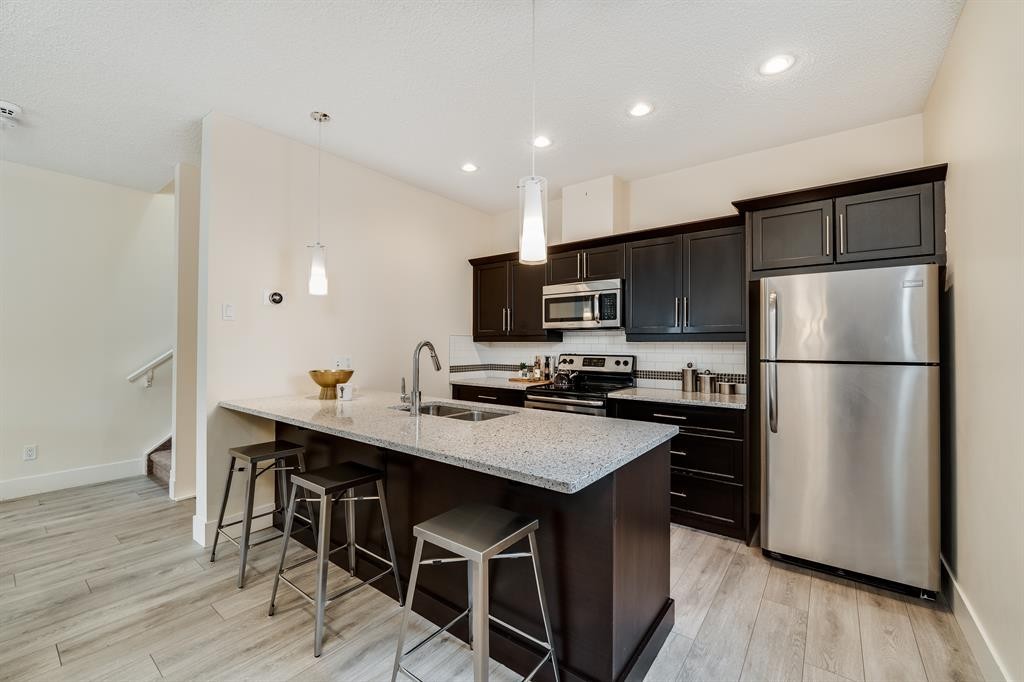 2-2008 12 Avenue Sw, Calgary, AB - Indoor Photo Showing Kitchen With Stainless Steel Kitchen With Double Sink