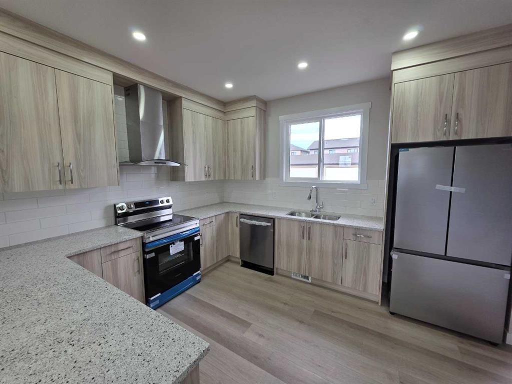 156 Belvedere Park Se, Calgary, AB - Indoor Photo Showing Kitchen With Stainless Steel Kitchen With Double Sink