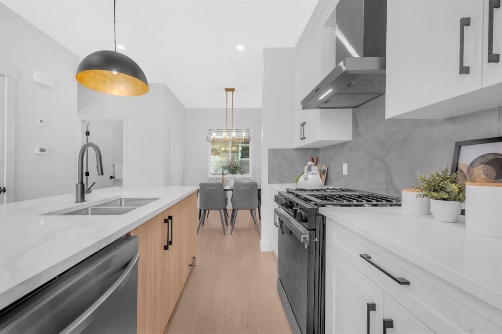1846 24 Avenue Nw, Calgary, AB - Indoor Photo Showing Kitchen With Double Sink With Upgraded Kitchen