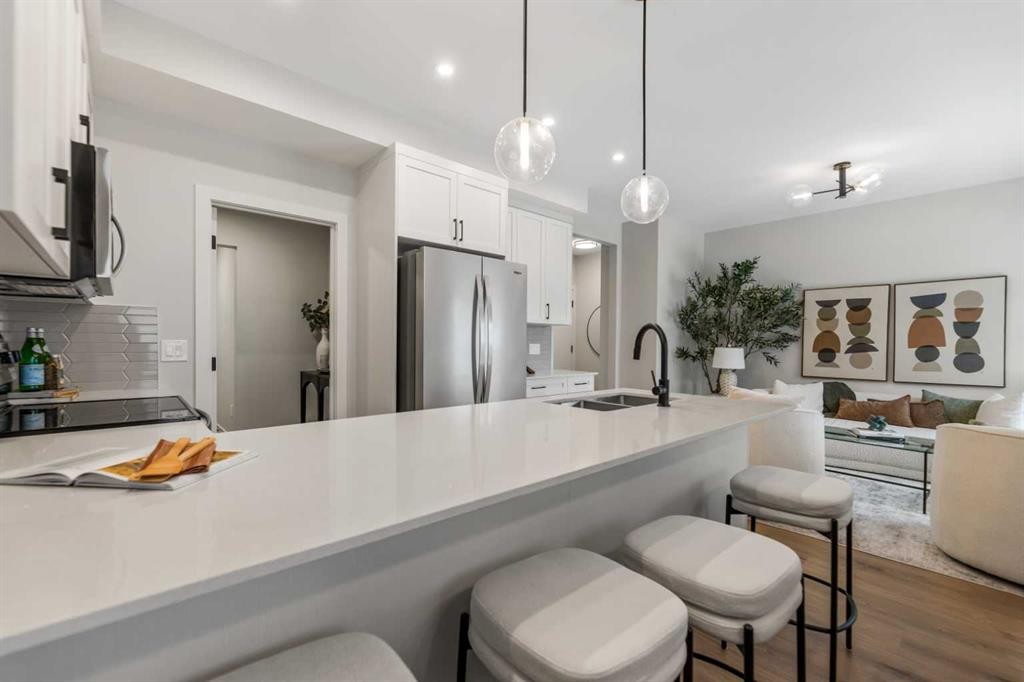 241 Waterford Heath, Chestermere, AB - Indoor Photo Showing Kitchen With Double Sink With Upgraded Kitchen