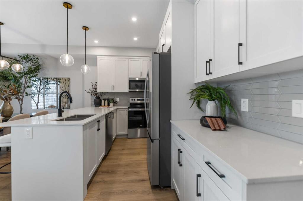 241 Waterford Heath, Chestermere, AB - Indoor Photo Showing Kitchen With Double Sink With Upgraded Kitchen