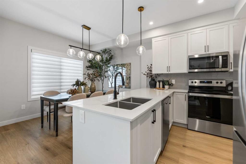 241 Waterford Heath, Chestermere, AB - Indoor Photo Showing Kitchen With Double Sink With Upgraded Kitchen