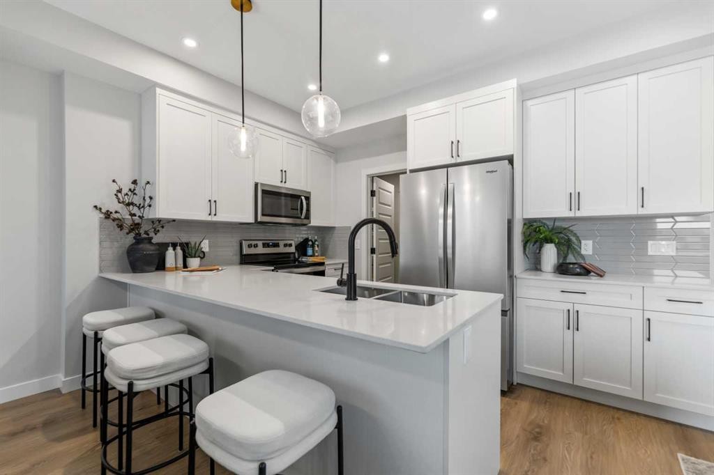 241 Waterford Heath, Chestermere, AB - Indoor Photo Showing Kitchen With Double Sink With Upgraded Kitchen